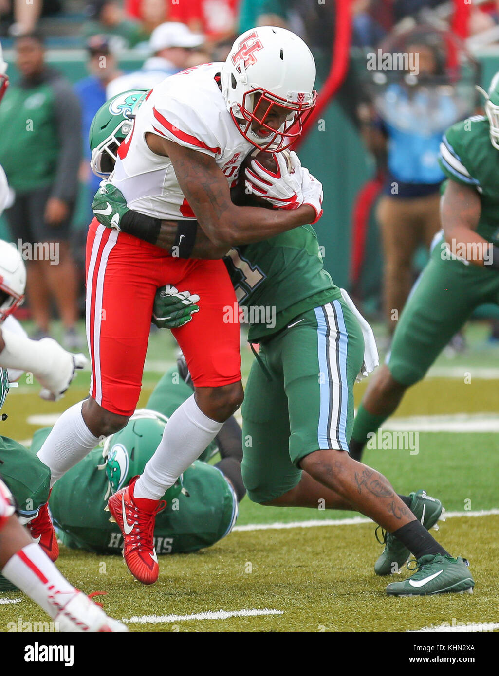 New Orleans, LA, USA. 18th Nov, 2017. Houston's John Leday #85 covers up the ball as he's tackled during the NCAA football game between the Tulane Green Wave and the Houston Cougars at Yulman Stadium in New Orleans, LA. Kyle Okita/CSM/Alamy Live News Stock Photo