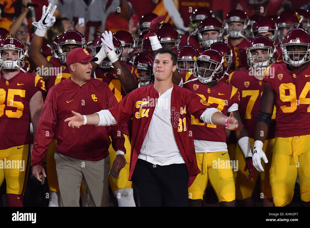 Los Angeles, CA, USA. 18th Nov, 2017. Los Angeles Dodgers Joc Pederson  leads the team on to the field before the NCAA Football game between the  USC Trojans and the UCLA Bruins