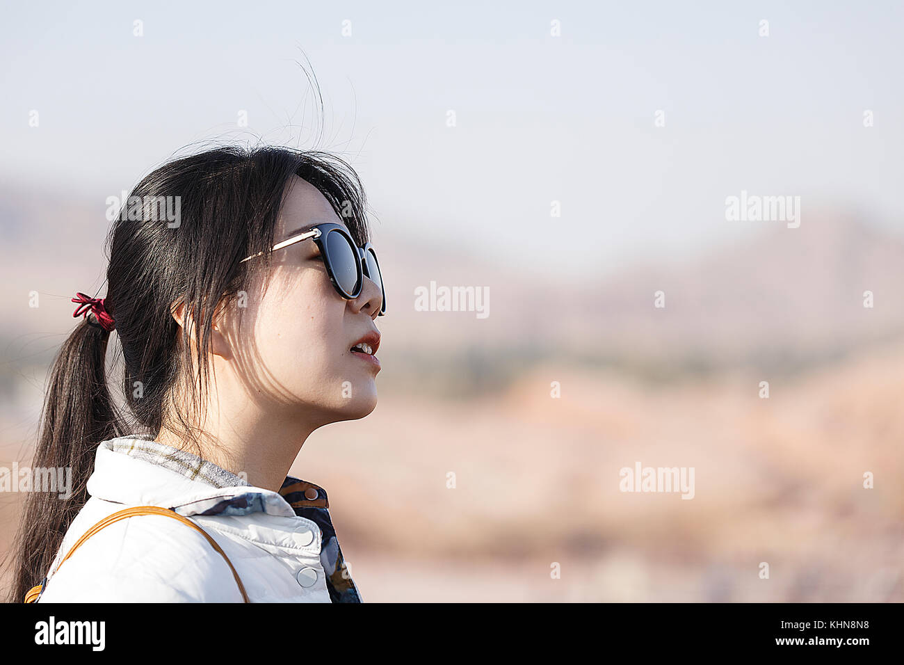 Zhanghye,China - October 15,2017: Young woman visits the Zhanghye Danxia geological park on October 15, China. Stock Photo