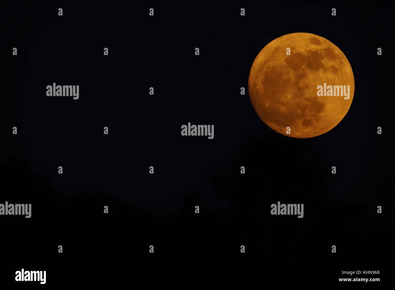 orange moon dark skies copy space detail Stock Photo