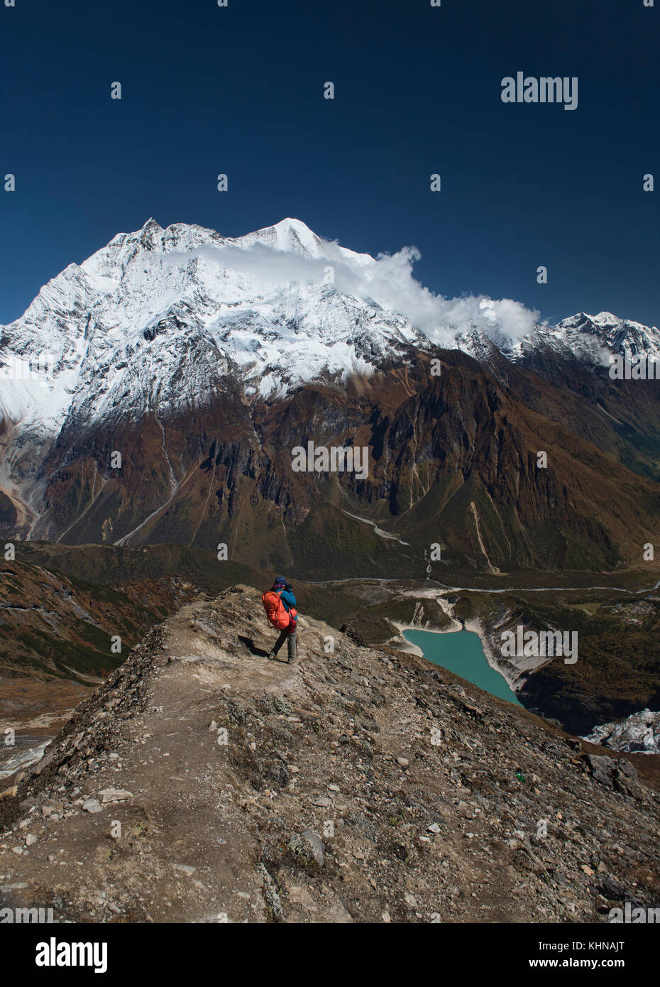 Looking out at Birendra Tal and Kutang Himal on the Tibetan border from the Manaslu Basecamp trail, Nepal Stock Photo