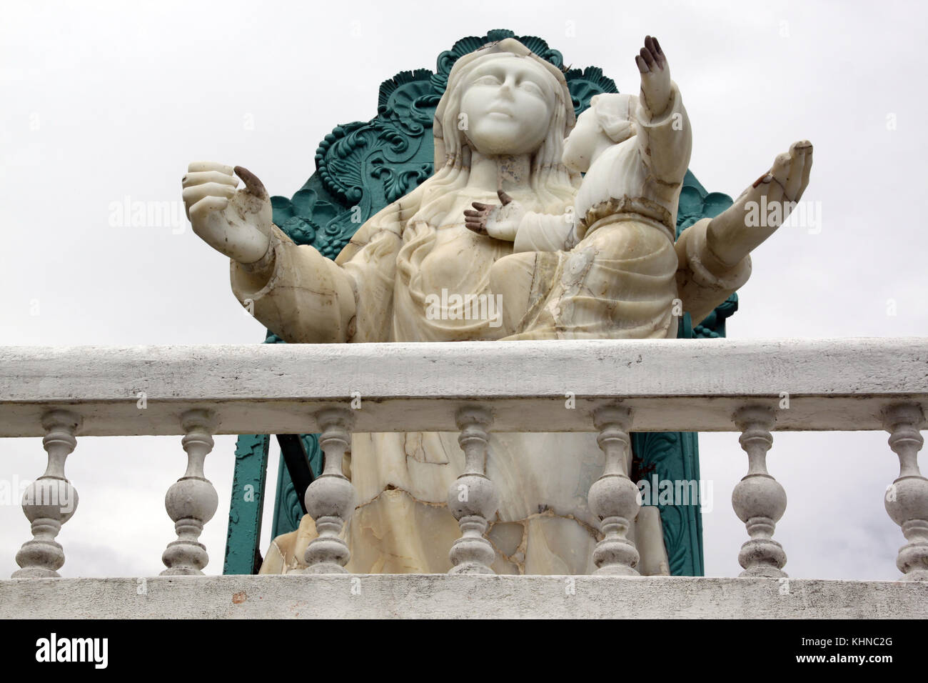 White statue of Virgin Mary on the hill in Banyos, Ecuador Stock Photo