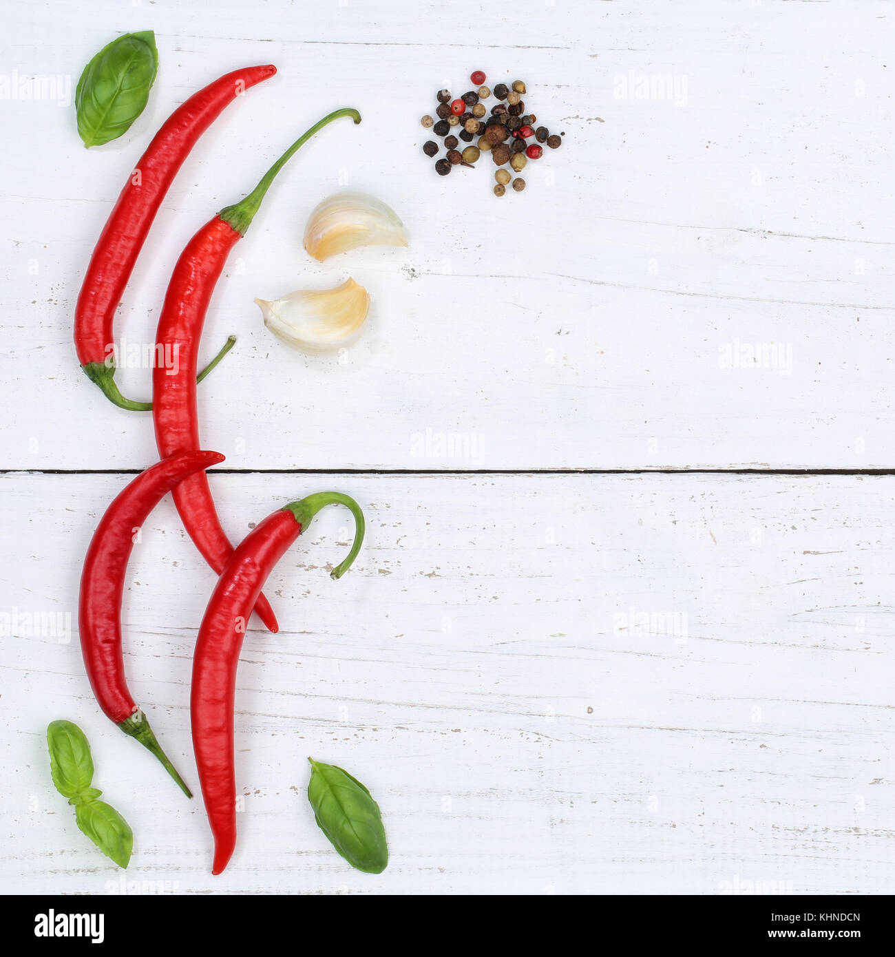 Red hot chili peppers chilli cooking ingredients copyspace square background top view from above Stock Photo
