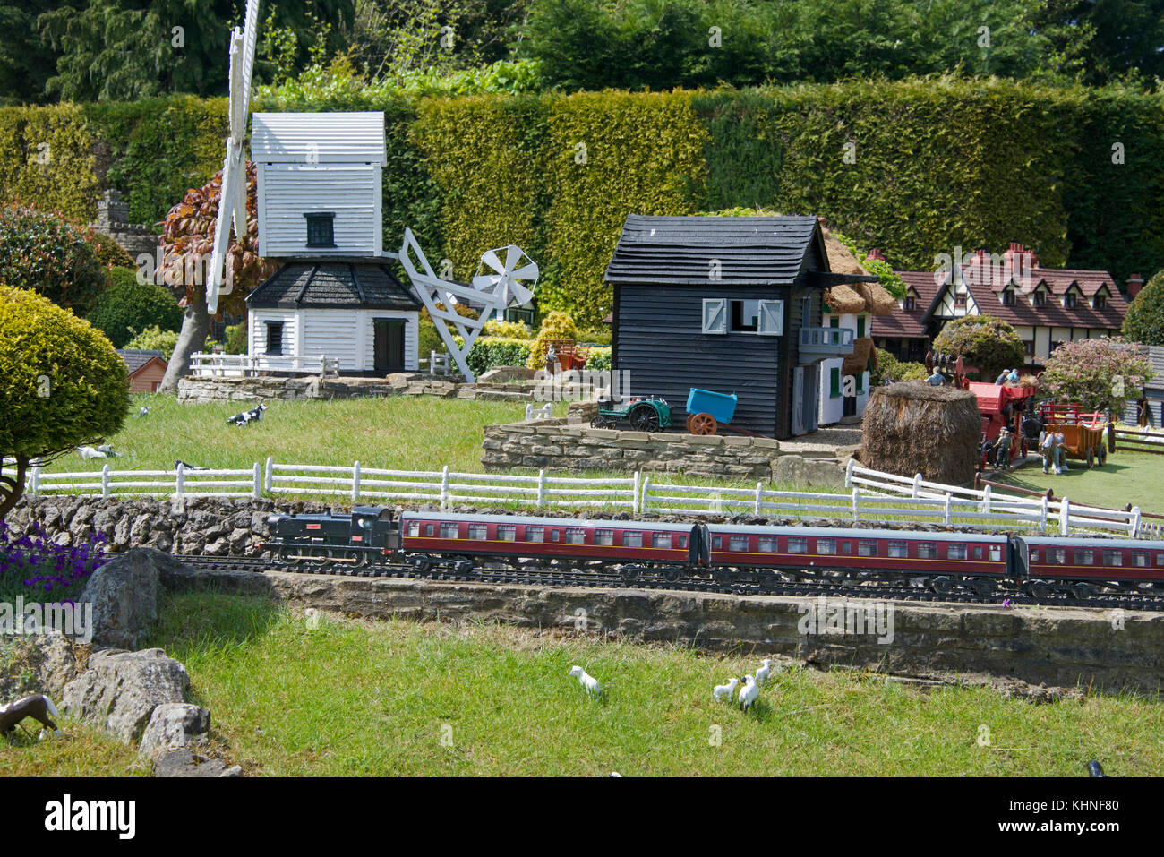 Train passing farm and windmill Bekonscot Model Village Beaconsfield