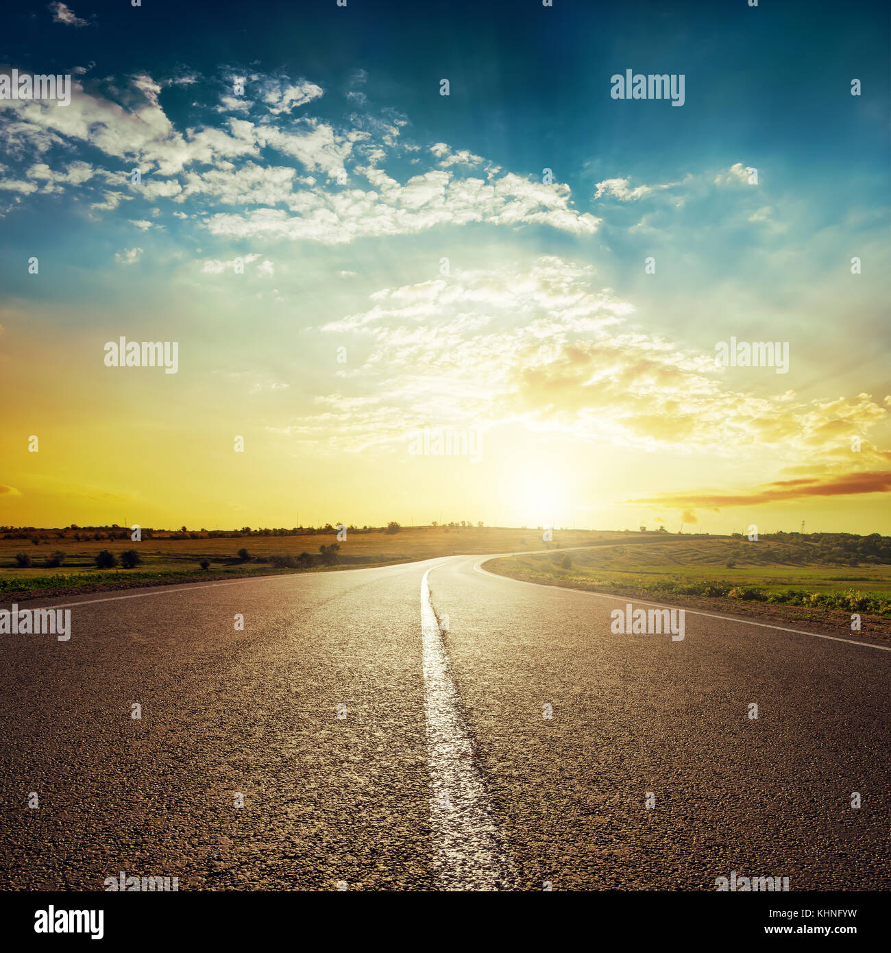 sunset and asphalt road Stock Photo - Alamy