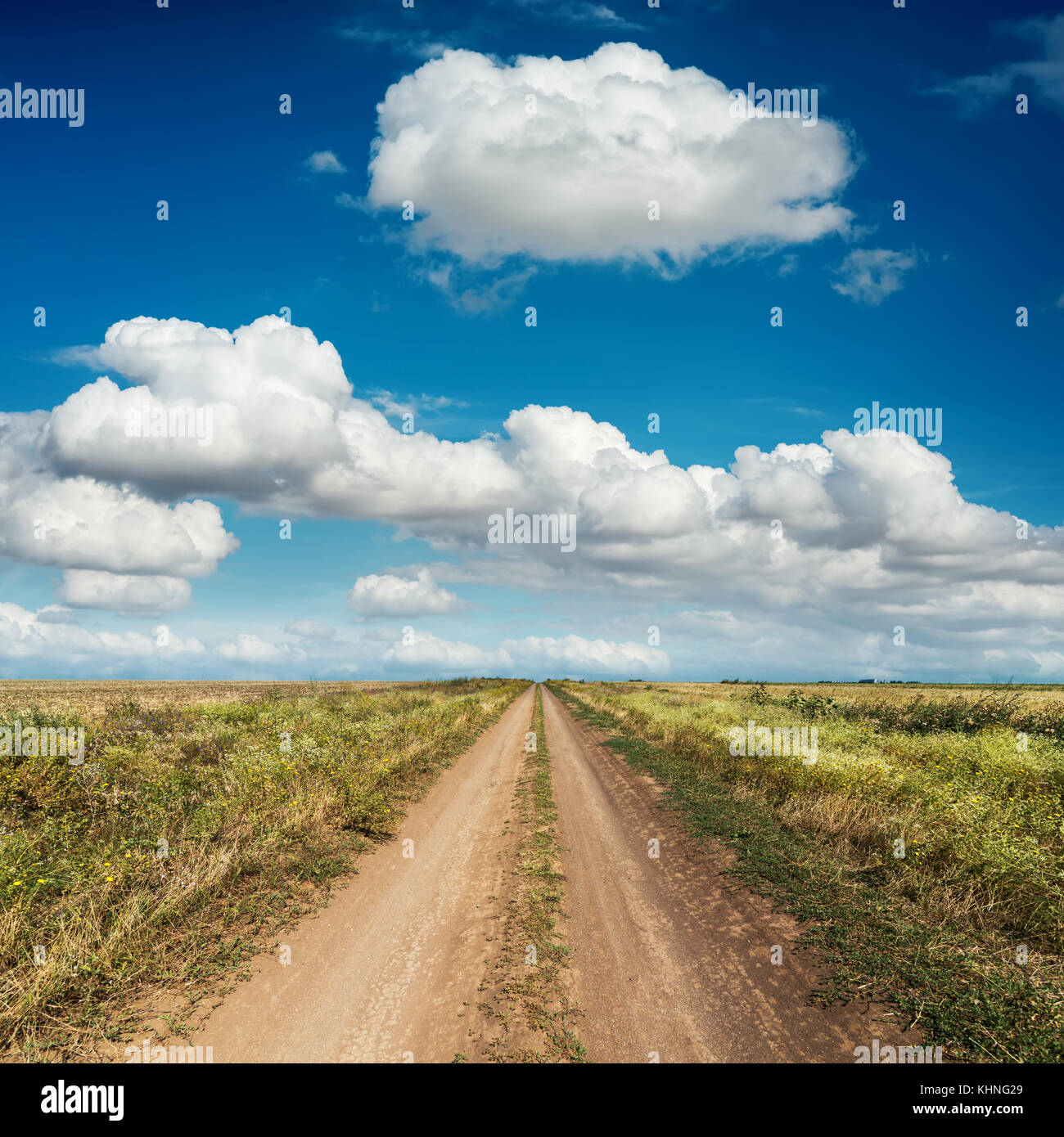 rural road and deep blue sky with clouds Stock Photo - Alamy