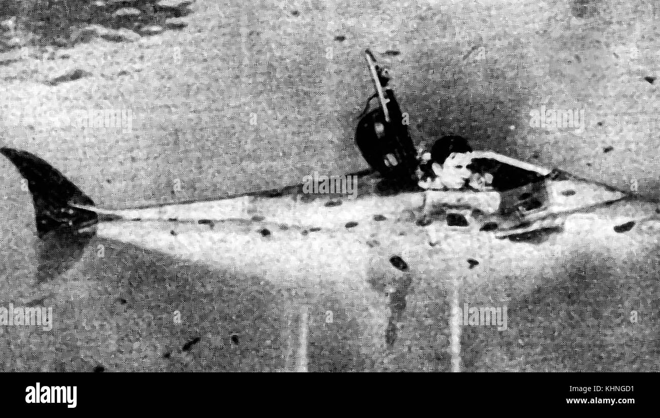 A newspaper image of Barney Connett and his home made battery powered.  fish shaped.periscope one man submarine in 1938 on Lake Michigan Stock Photo