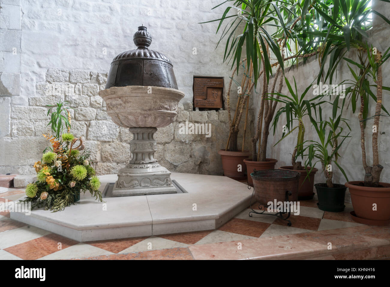 View of the baptismal font of the church of Sant'Andrea Apostle in Venzone, Friuli, Italy Stock Photo
