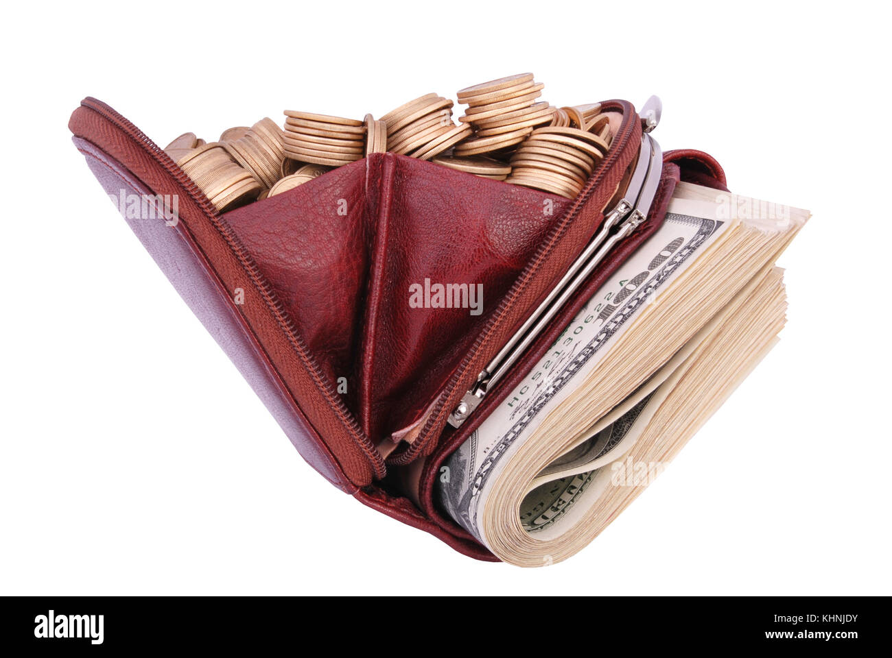 Brown leather purse full of coins and bank-paper. Isolated on a white background. Stock Photo