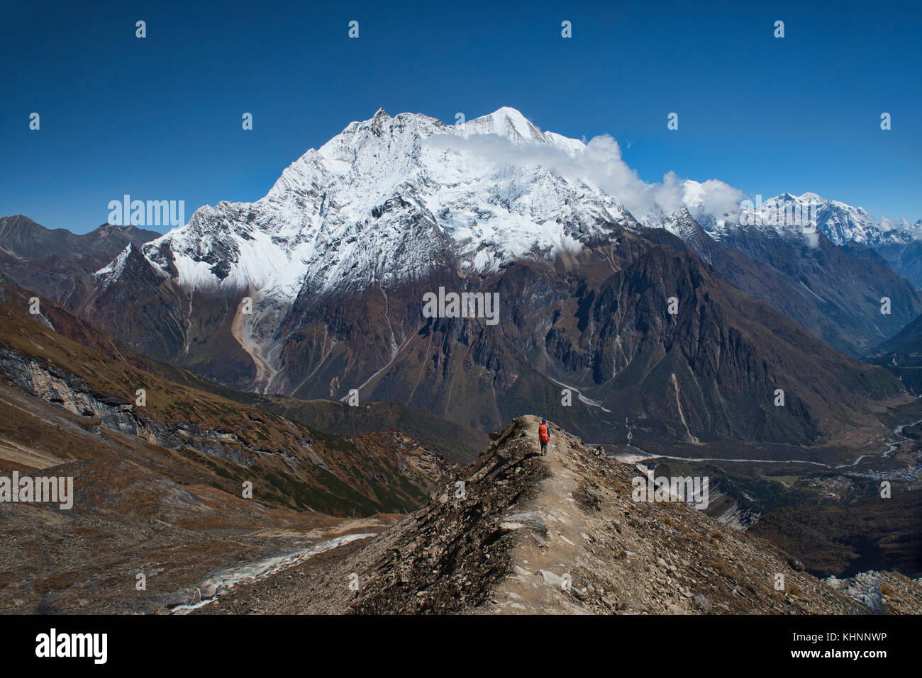 Looking out at the Kutang Himal on the Tibetan border from the Manaslu Basecamp trail, Nepal Stock Photo