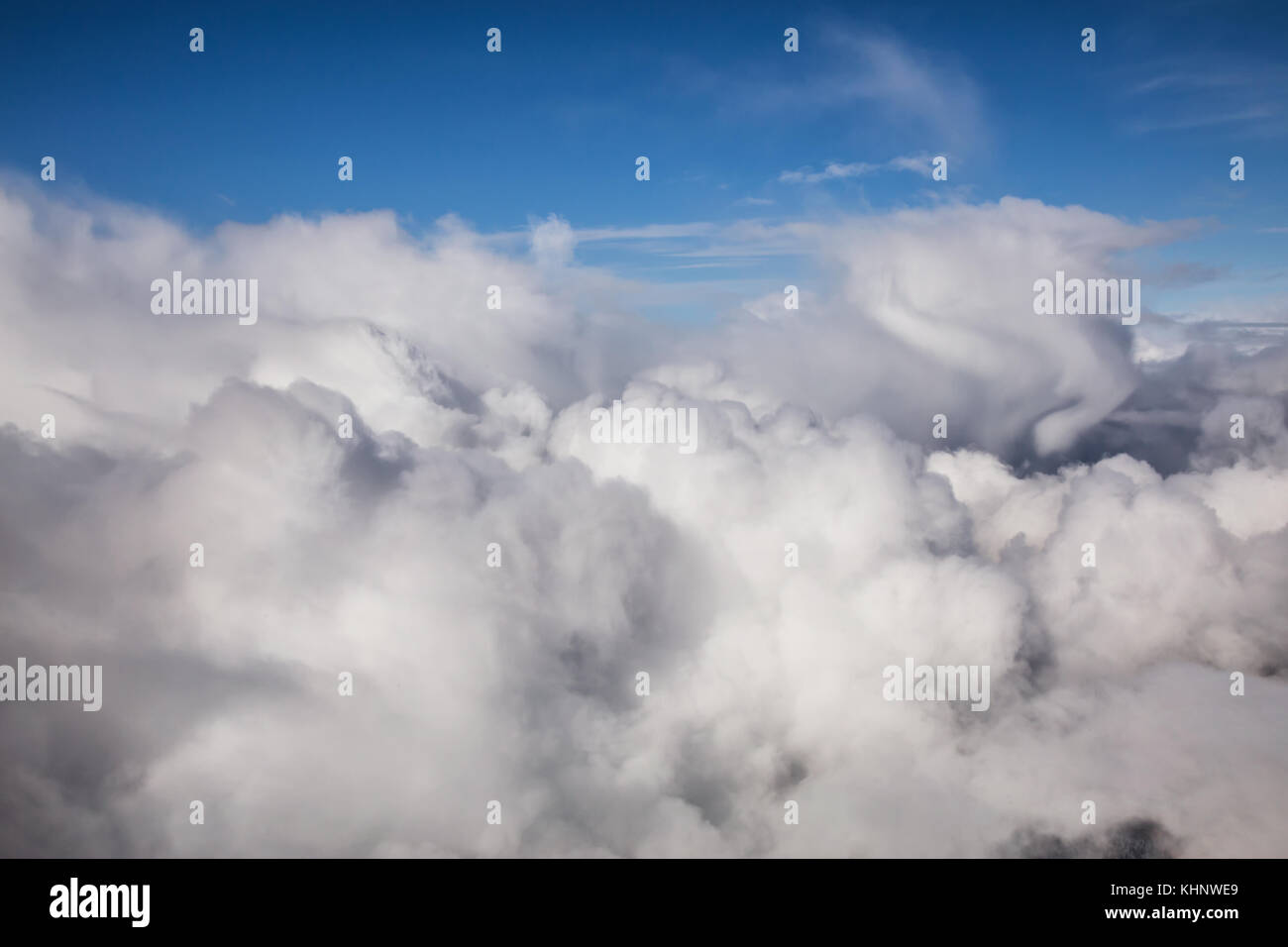 Aerial view of the blue sky above the layer of cumulus clouds Stock ...