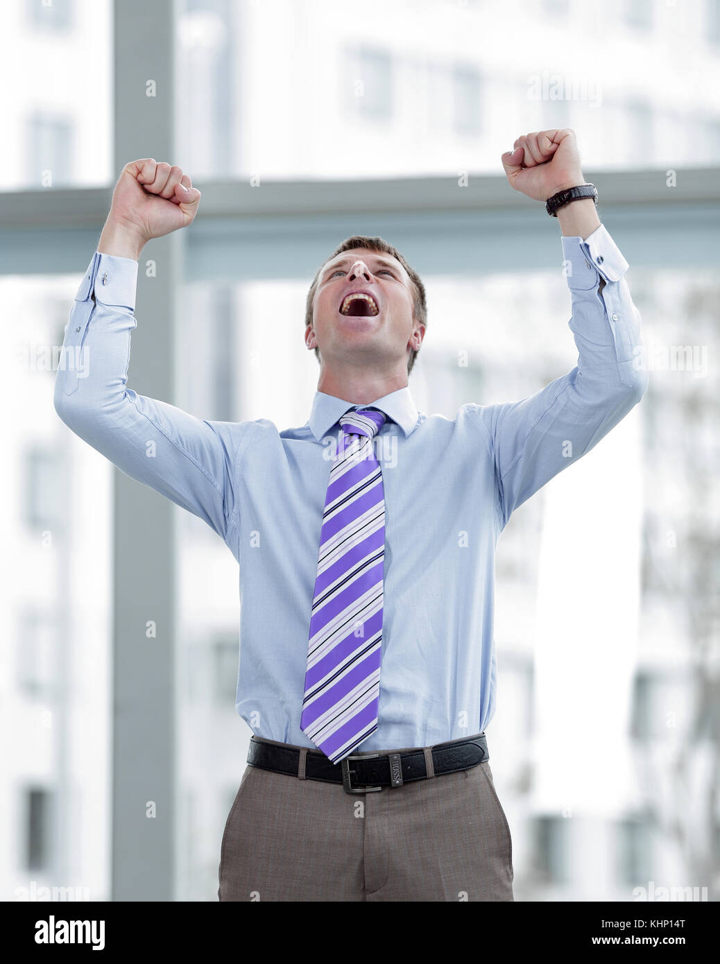 Businessman celebrating with his fists raised in the air Stock Photo ...