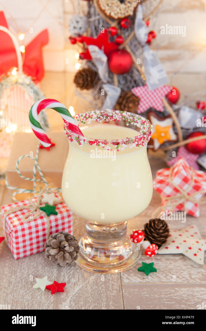 Egg nog with candy cane and sugar sprinkles Stock Photo Alamy