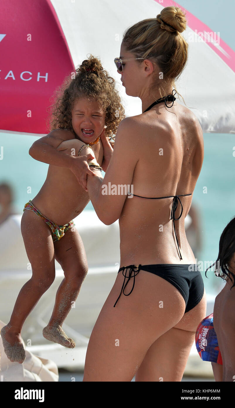 MIAMI, FL - JANUARY 03: Victoria's Secret supermodel Doutzen Kroes looks  like she's on her last nerve when her kids looked like they were having  temper tantrums at the beach. Doutzen was