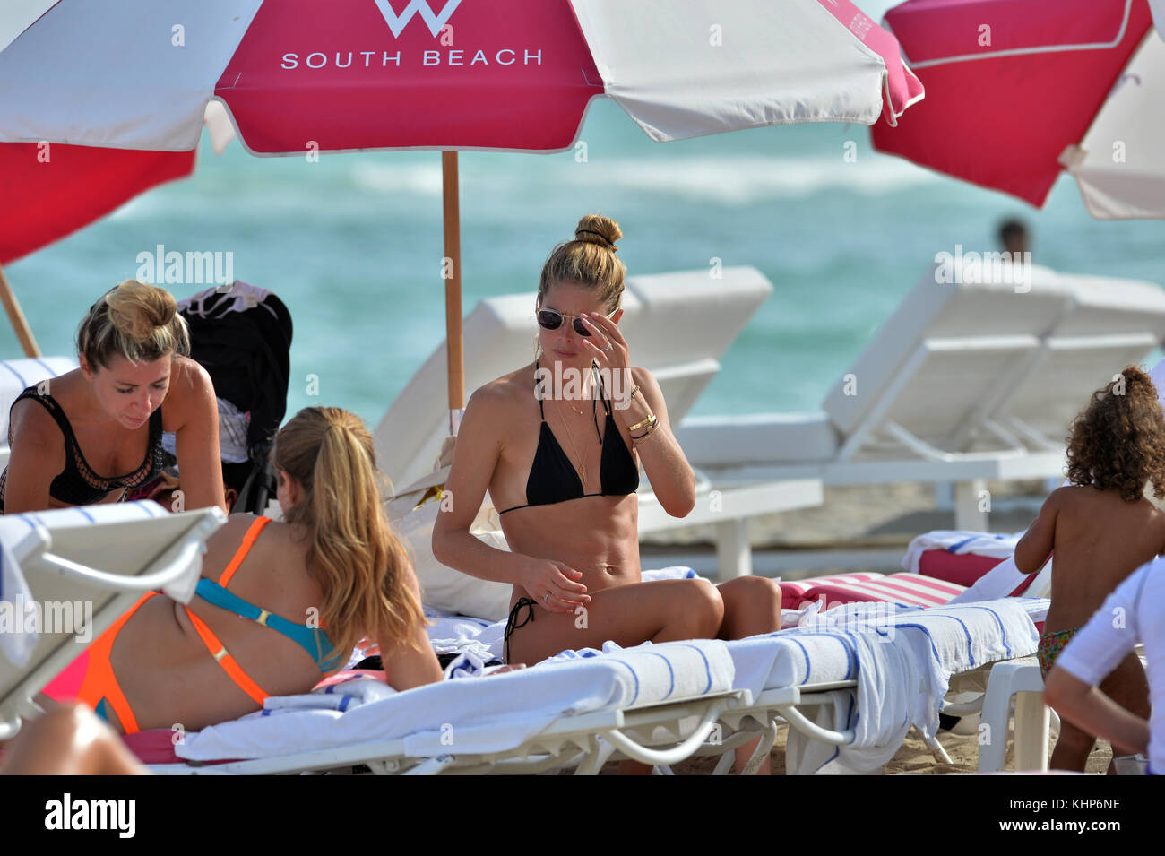 MIAMI, FL - JANUARY 03: Victoria's Secret supermodel Doutzen Kroes looks like she's on her last nerve when her kids looked like they were having temper tantrums at the beach. Doutzen was wearing a skimpy black triangle string bikini as she tried to hold it together and cheer up, her son Phyllon, five, and daughter Myllena. A few minuets later the family left the beach perhaps for a much needed nap for everyone on January 3, 2017 in Miami  Florida  People:  Doutzen Kroes Stock Photo