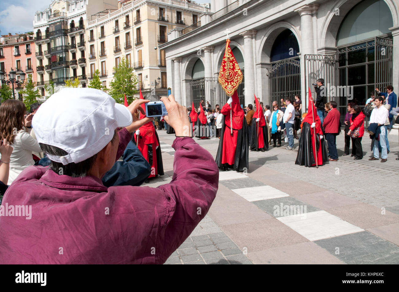 Man taking photos of a Holy Week procession. Oriente Square, Madrid, Spain. Stock Photo