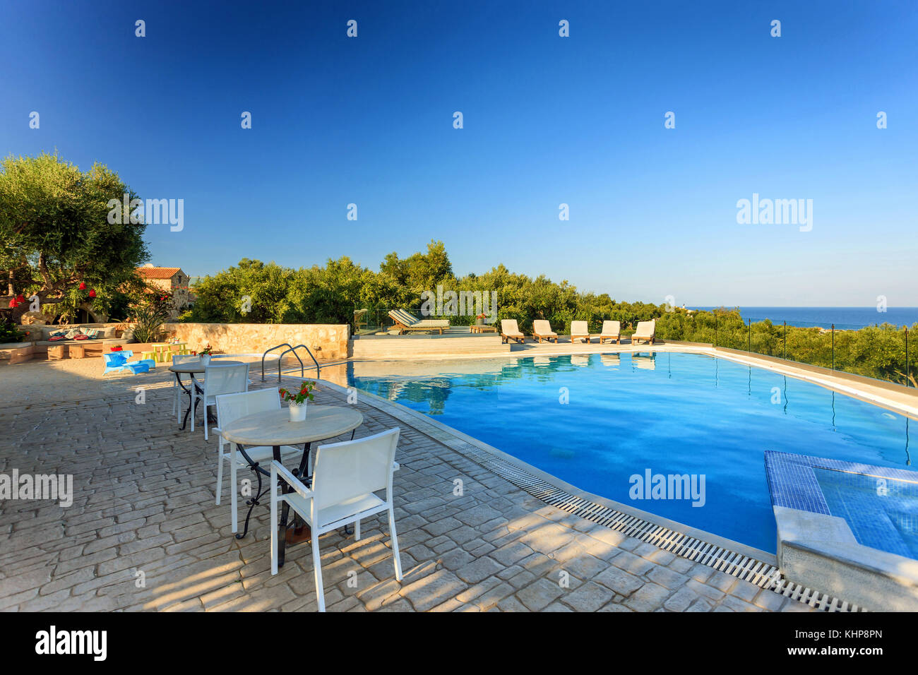Image showcasing big luxury pool in a summer resort in Greece Stock Photo - Alamy