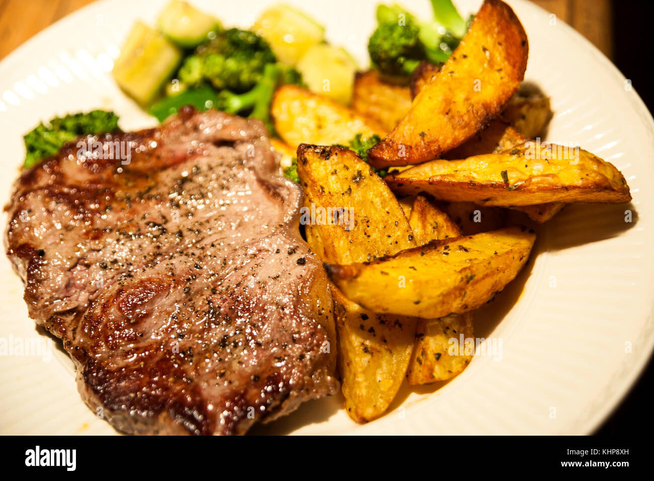 Beefsteak with Baked Potatoes,Broccoli and Zucchini Stock Photo