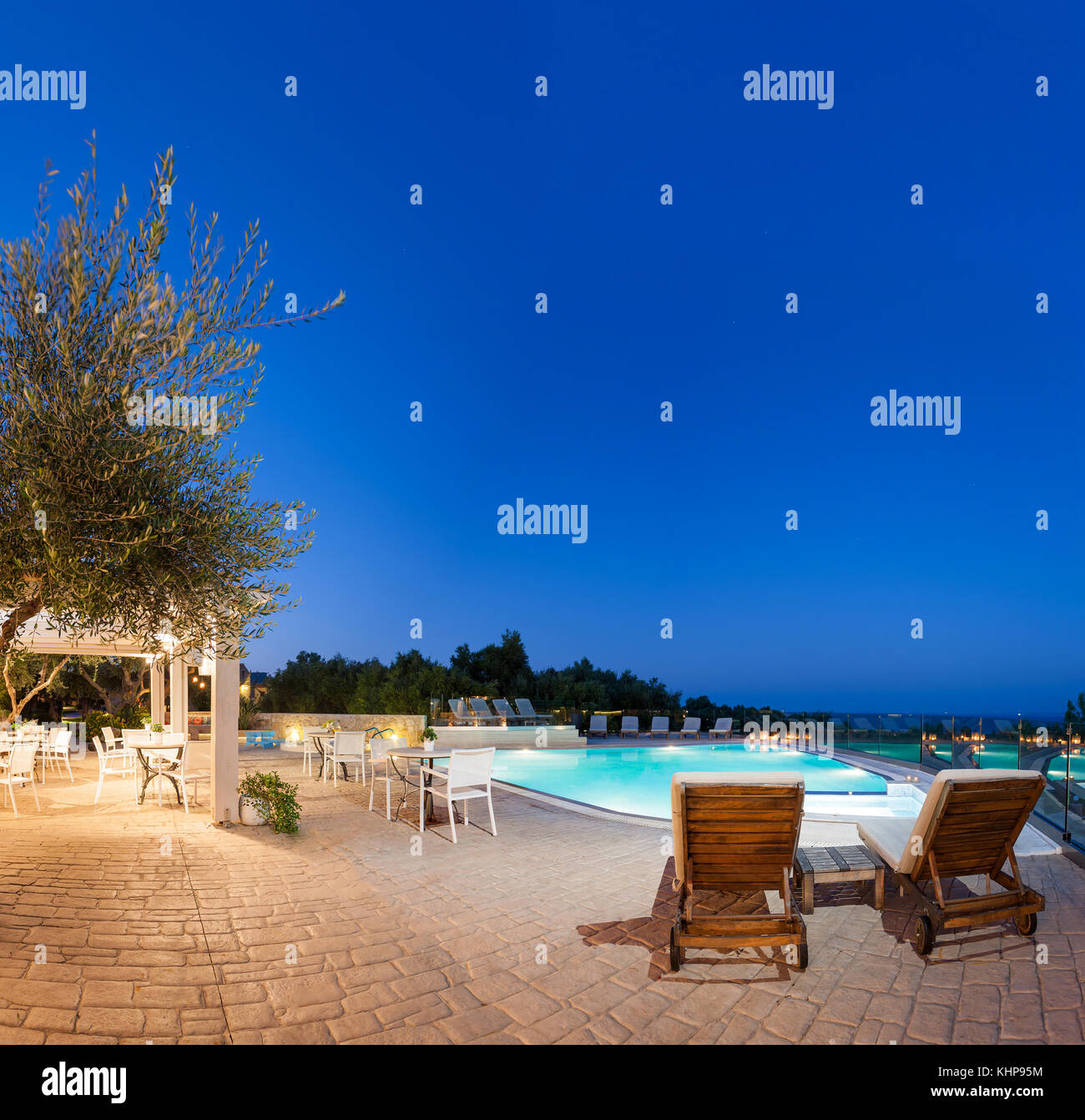 Greek Pool Night big luxury pool at night in a summer resort in Greece Stock Photo - Alamy