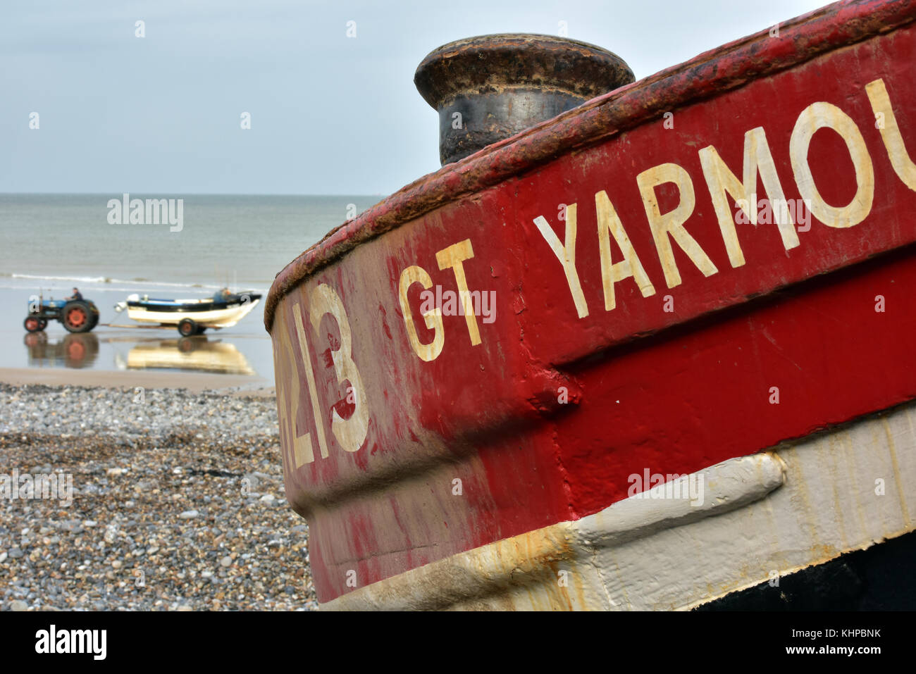 a crab fishing boat on the beach at cromer in Norfolk with a tractor