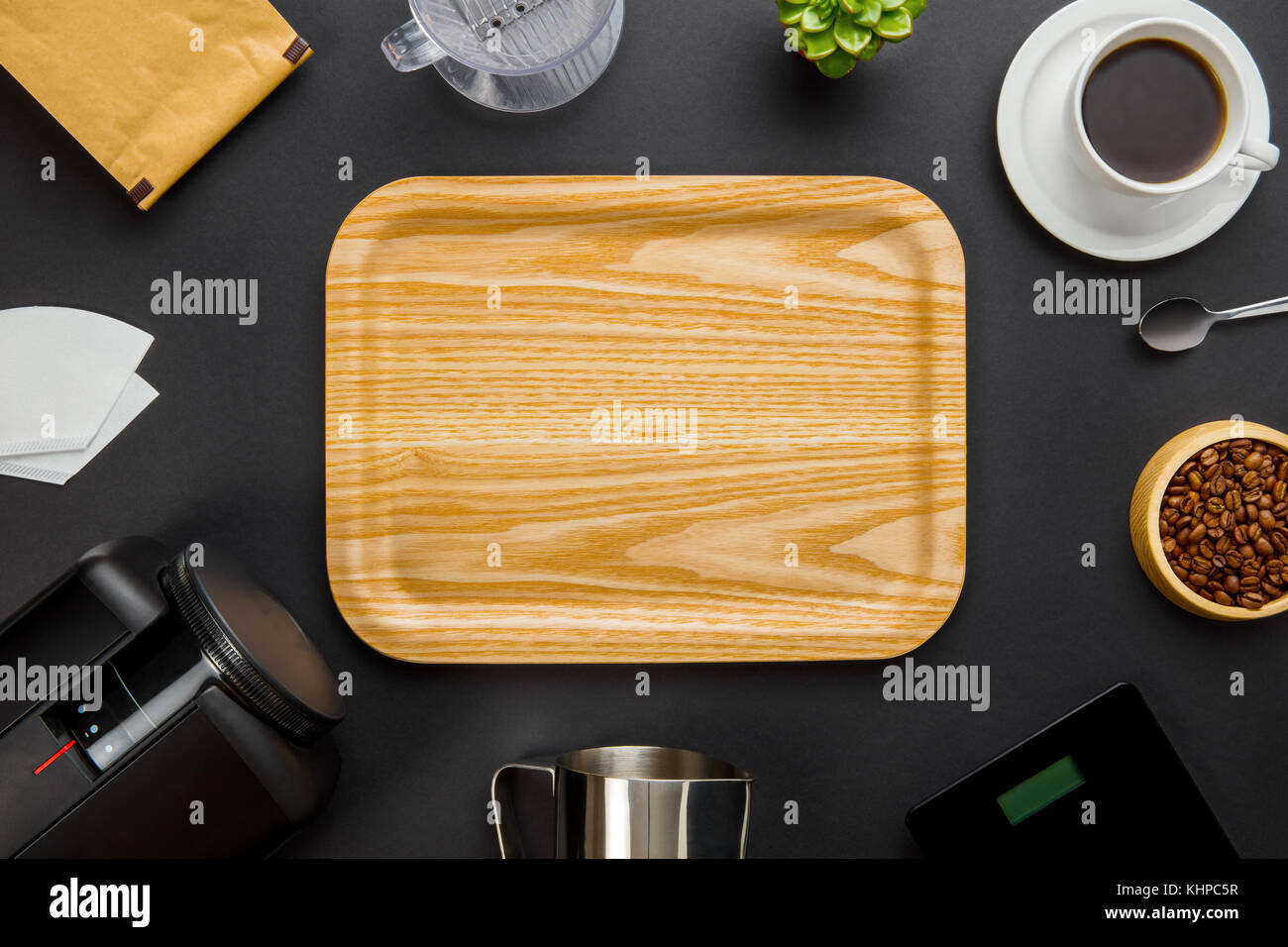 Wooden Tray Surrounded By Coffee Making Equipment On Gray Backgr Stock Photo