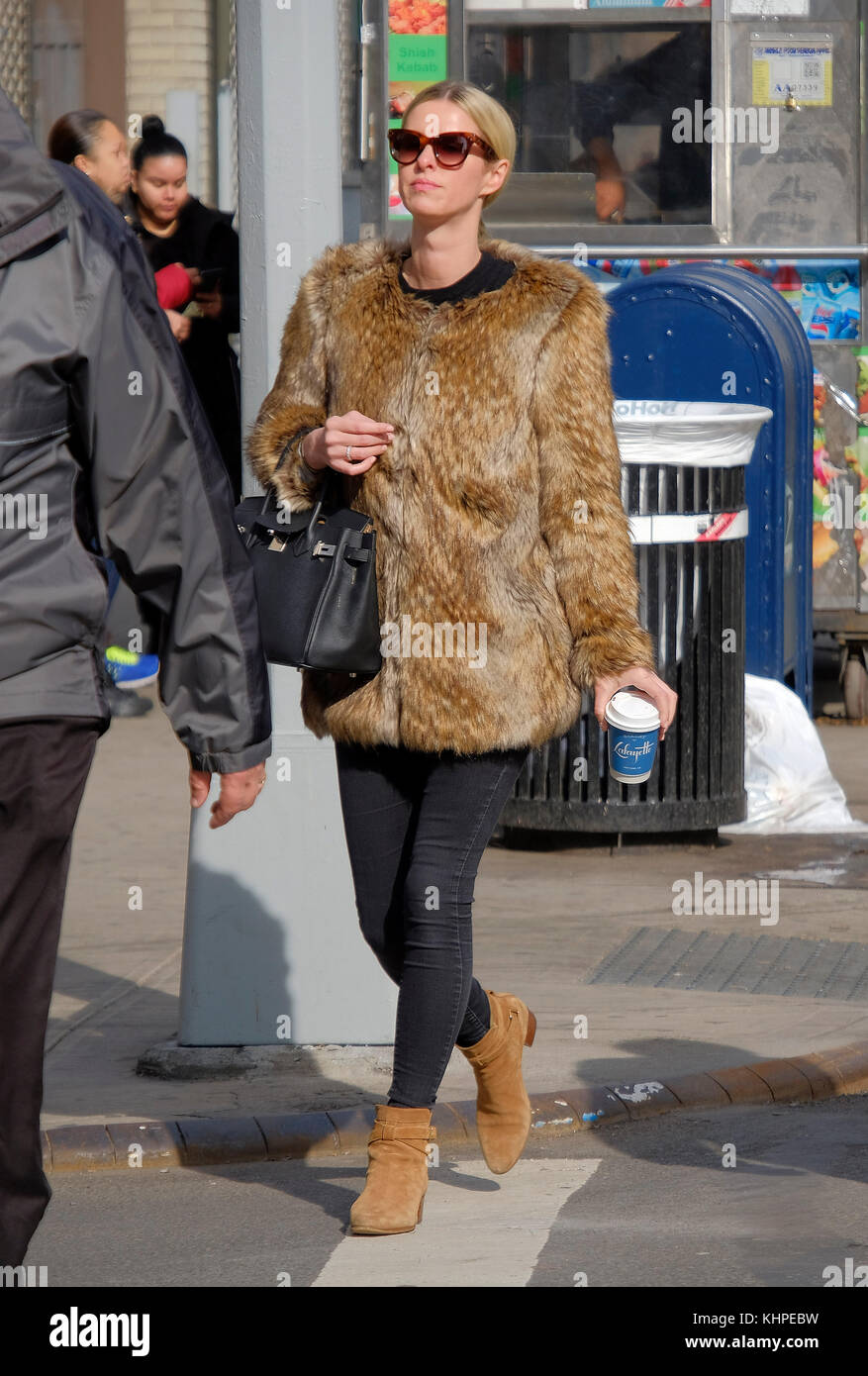 NEW YORK NY JANUARY 30 Socialite Nicky Hilton Rothschild wears a short fur jacket and carries a Hermes Birkin bag as she walks around her East Village neighborhood on January 30