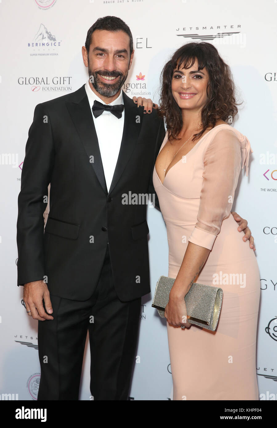 Robert Pires and Jessica Lemarie-Peres attending the Global Gift Gala held at The Corinthia Hotel in London. Stock Photo