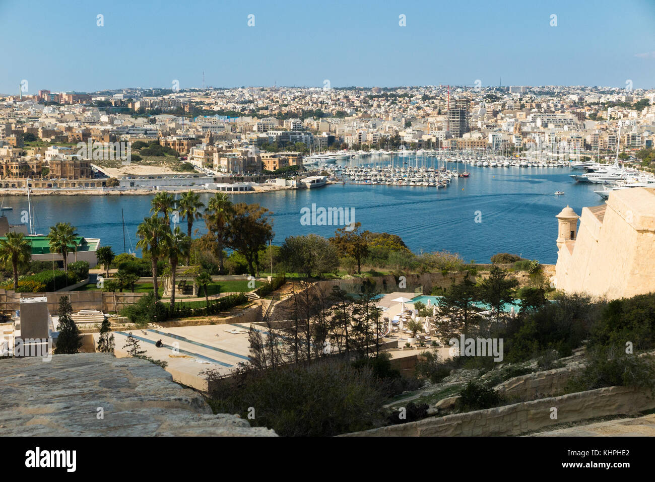 Looking over Marsamxett Harbour to Ta' Xbiex in the distance on the left, and Manoel Island and Manoel Marina on the right, from Valletta, Malta. (9 Stock Photo