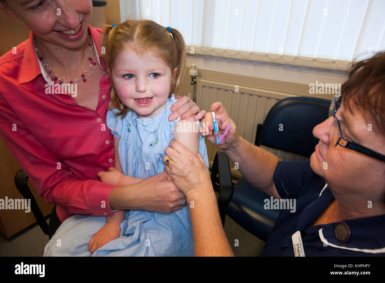 Practice nurse giving NHS 4in1 preschool booster / Pre school