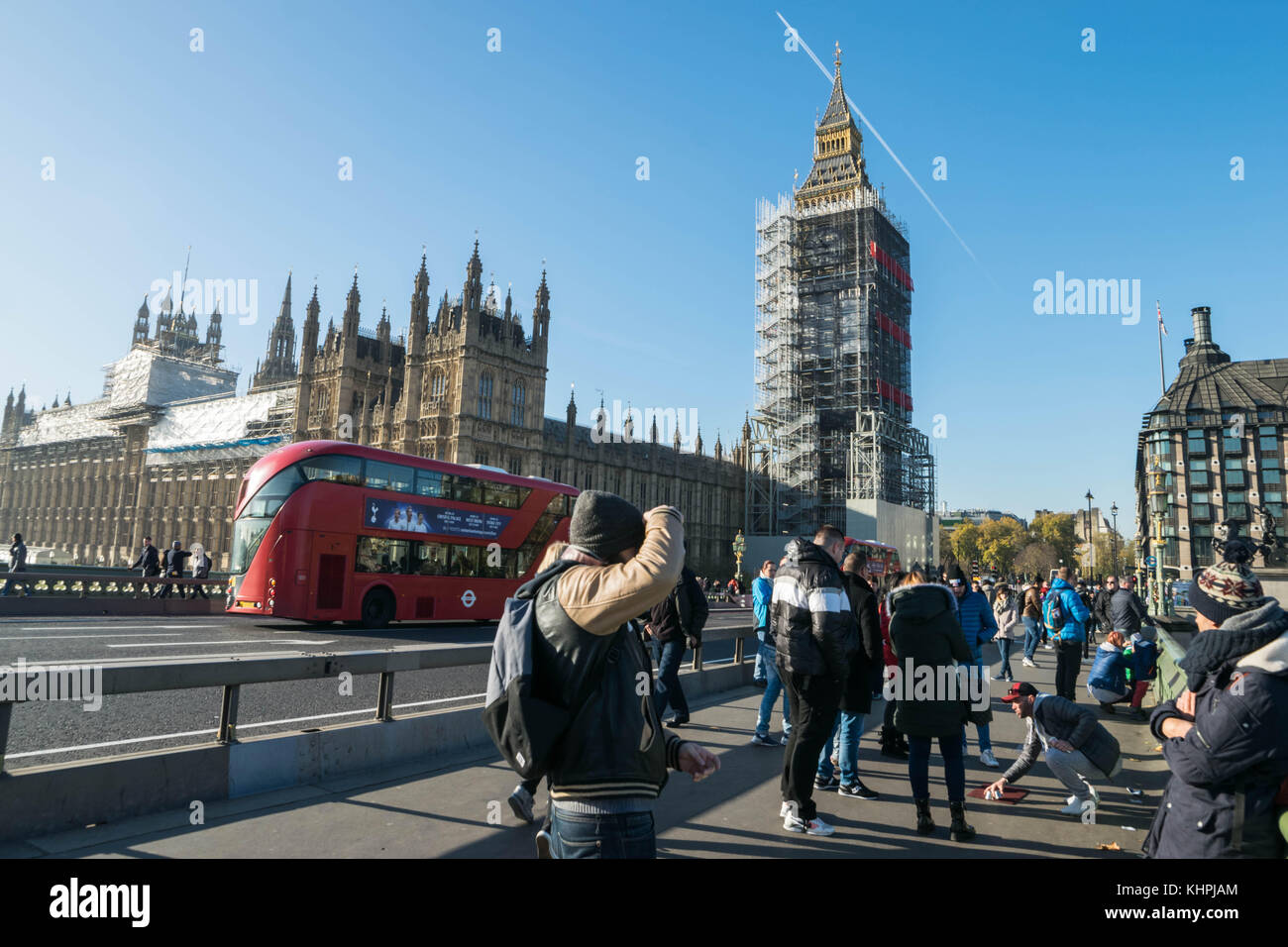 LONDON, UK - October 17th, 2017: Westminster bridge and big ben renovation scaffolding construction with the house of parliament in view, sunny day, clear sky. Stock Photo