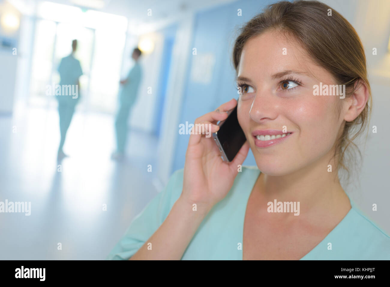 female nurse using cell phone in hospital Stock Photo Alamy