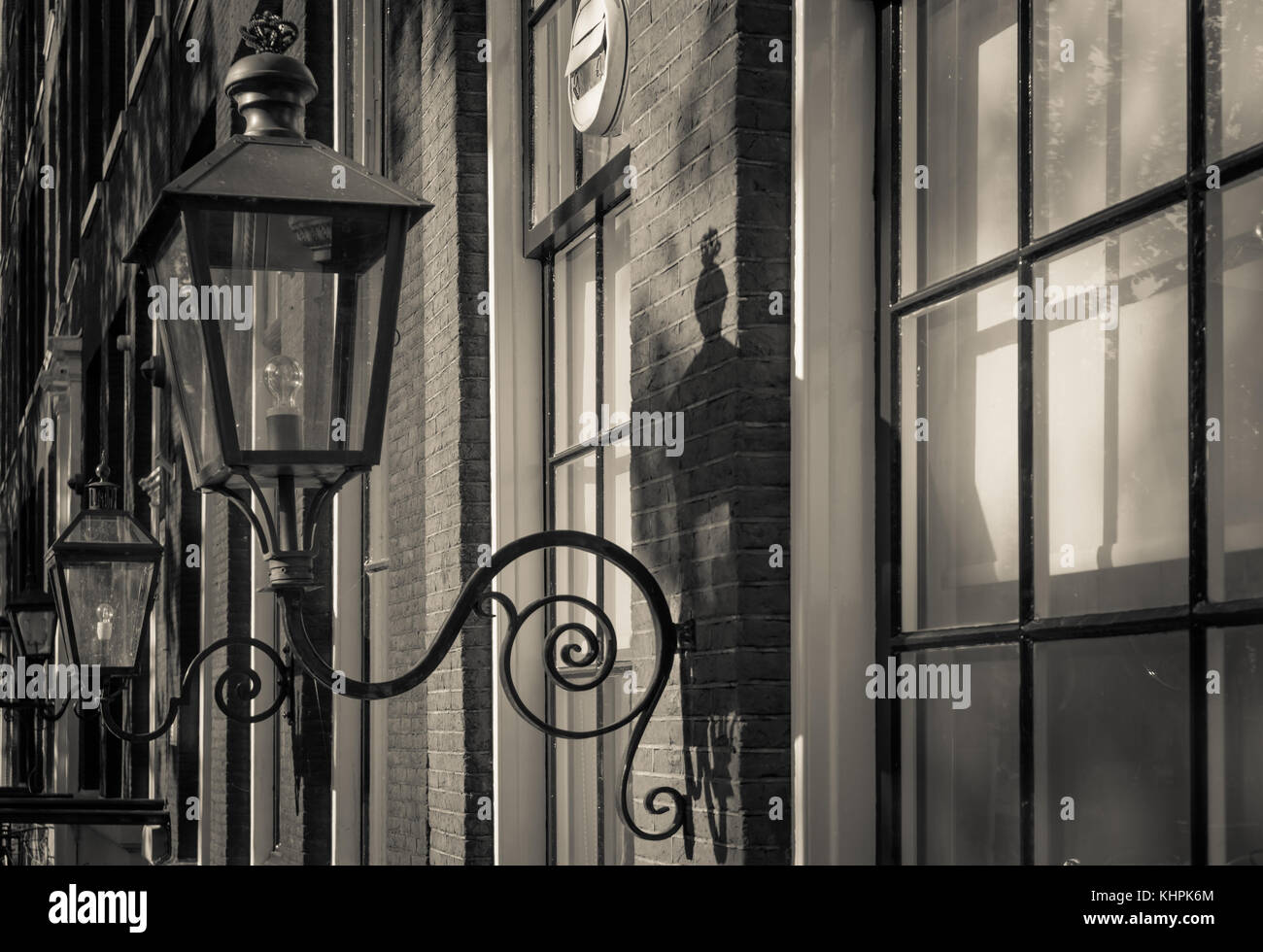 Vintage lights on the buildings in the old city of Amsterdam. Retro ...