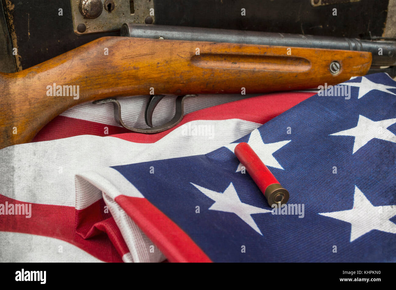 Bullet on the USA flag with old rifle Stock Photo - Alamy