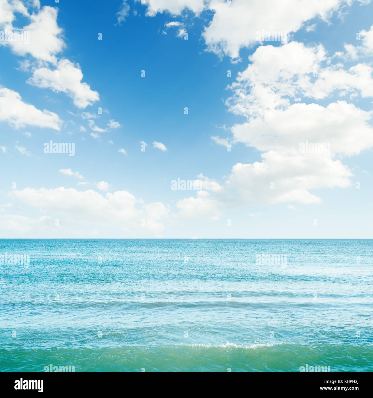 blue sea and clouds in sky over it Stock Photo - Alamy
