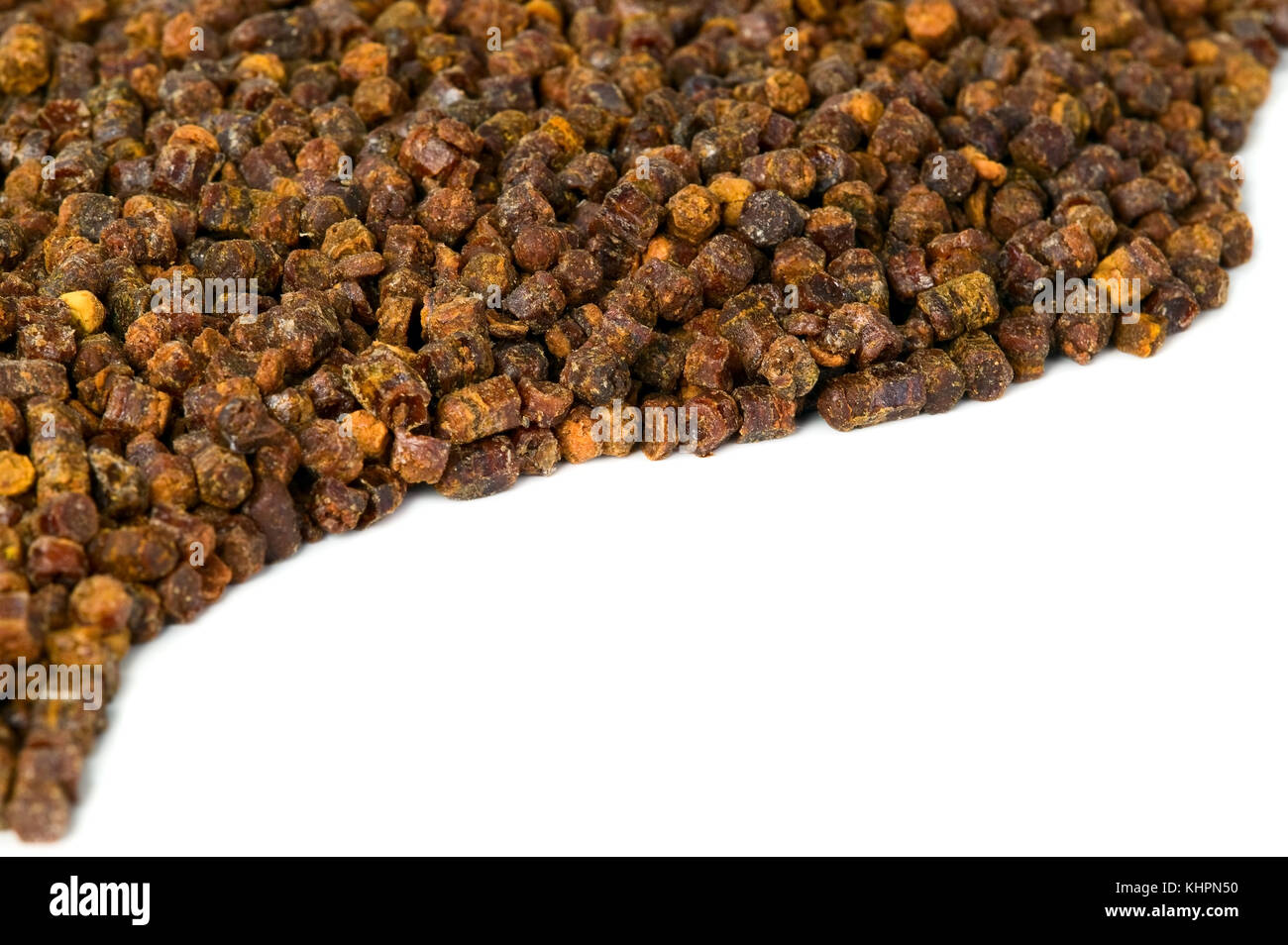 Propolis granules on white background, bee product, frame composition Stock Photo