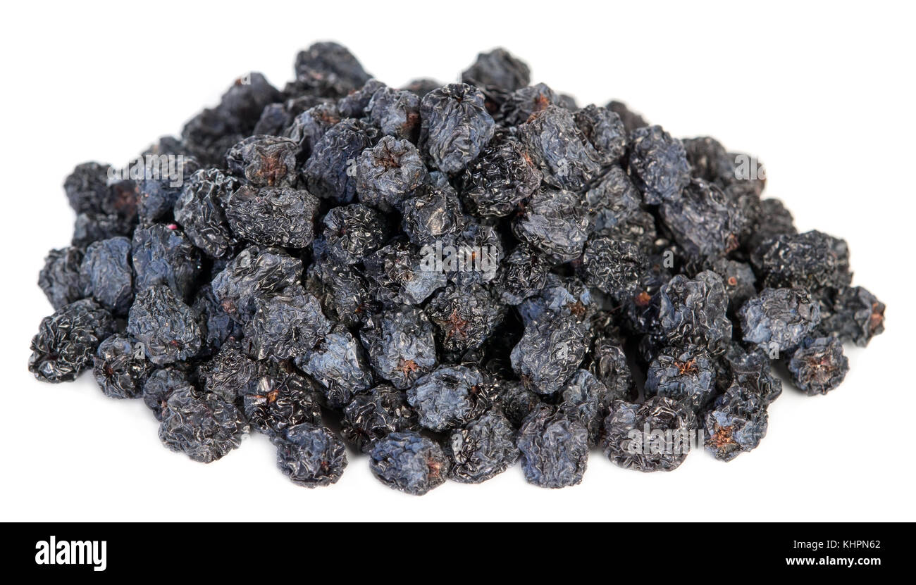 Dried black aronia berries on white background Stock Photo