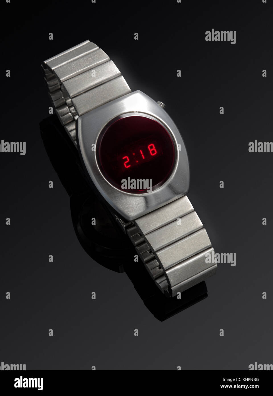 Commodore Digital wrist watch and stainless steel band against a black background Stock Photo