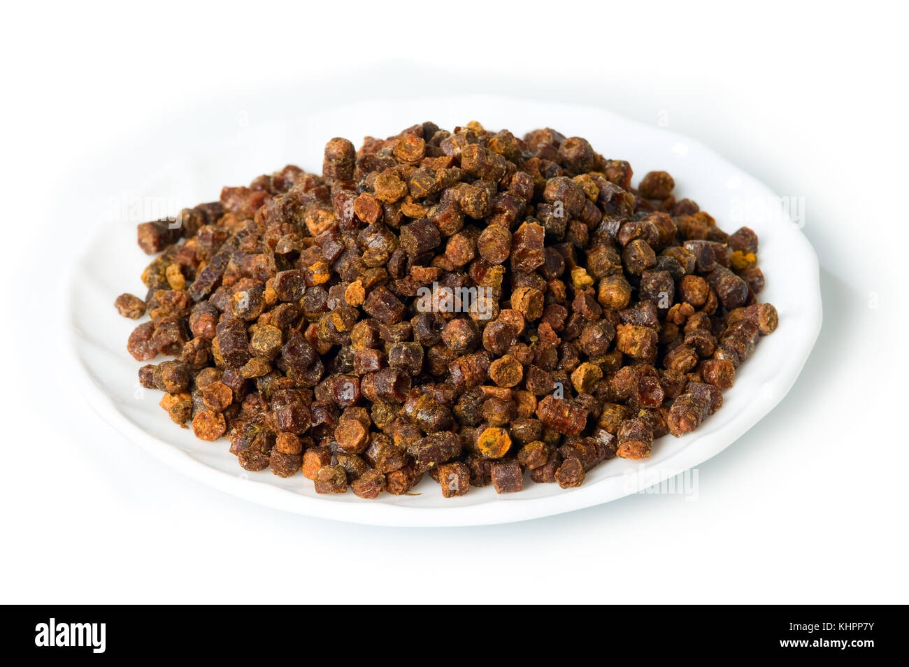 Propolis granules inside plate on background, bee product Stock Photo ...