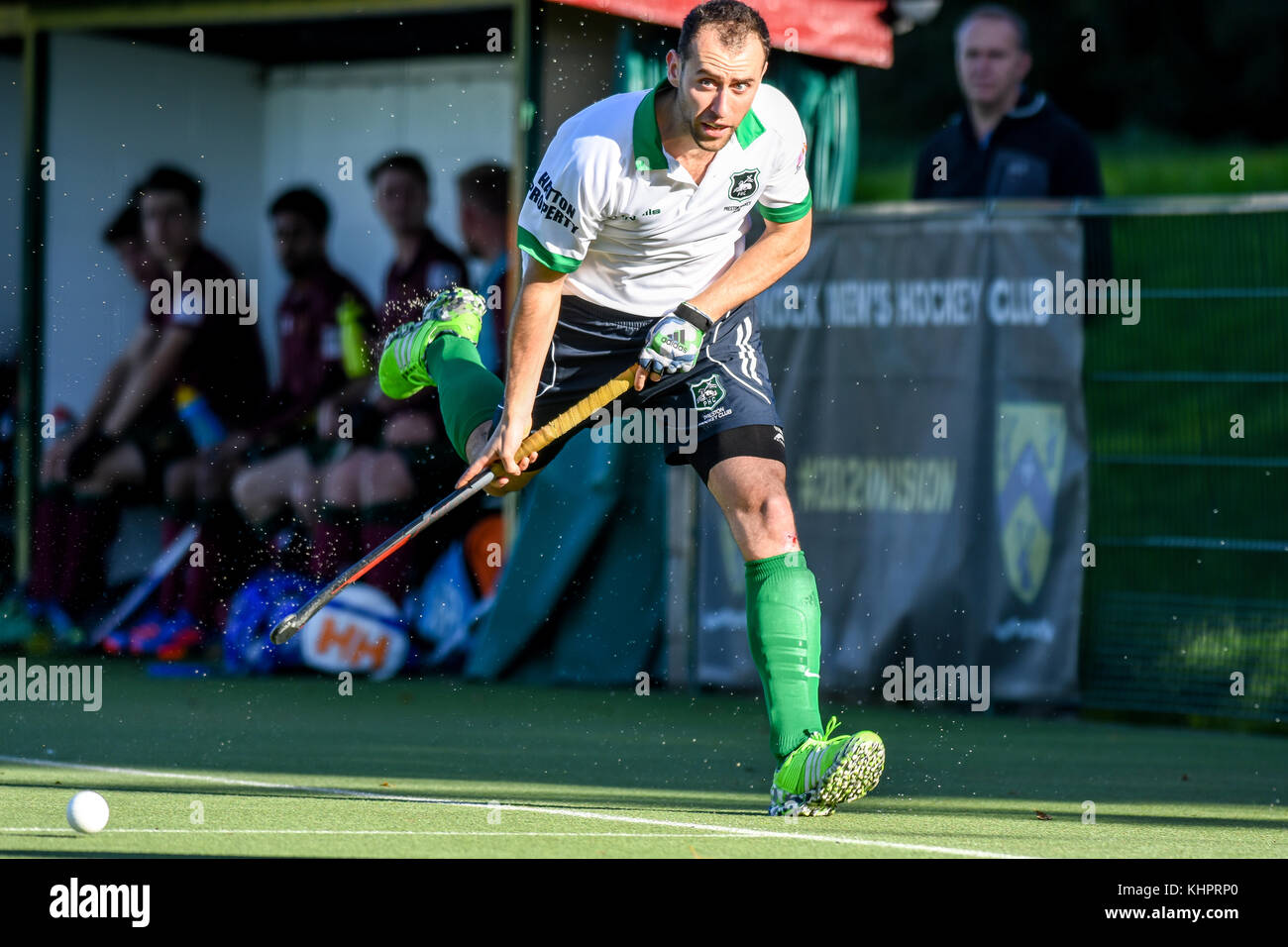 Mens field hockey, England, UK. Player running with the ball Stock
