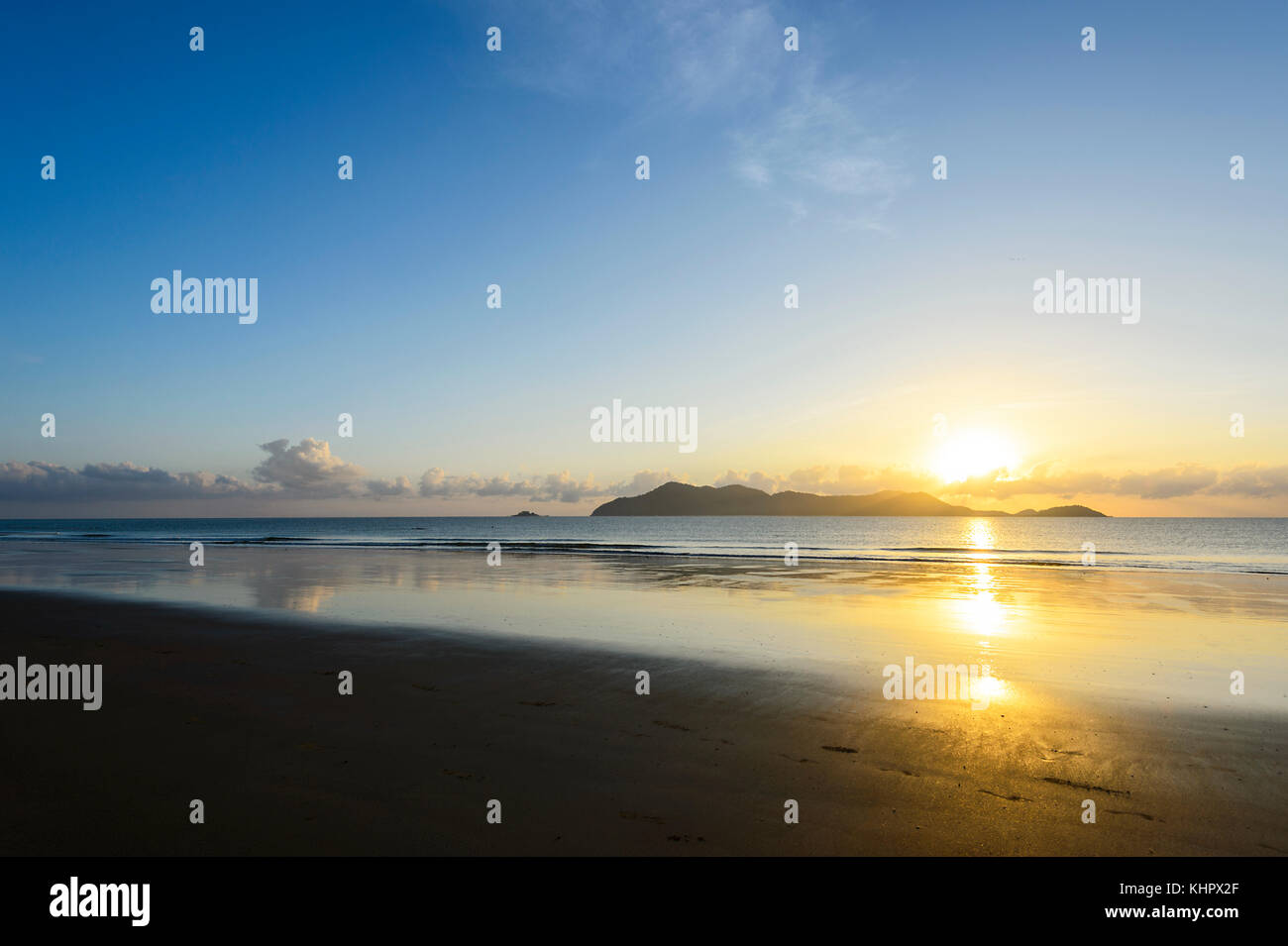 Atmospheric sunrise over the Coral Sea at South Mission Beach, Far North Queensland, FNQ, Australia Stock Photo