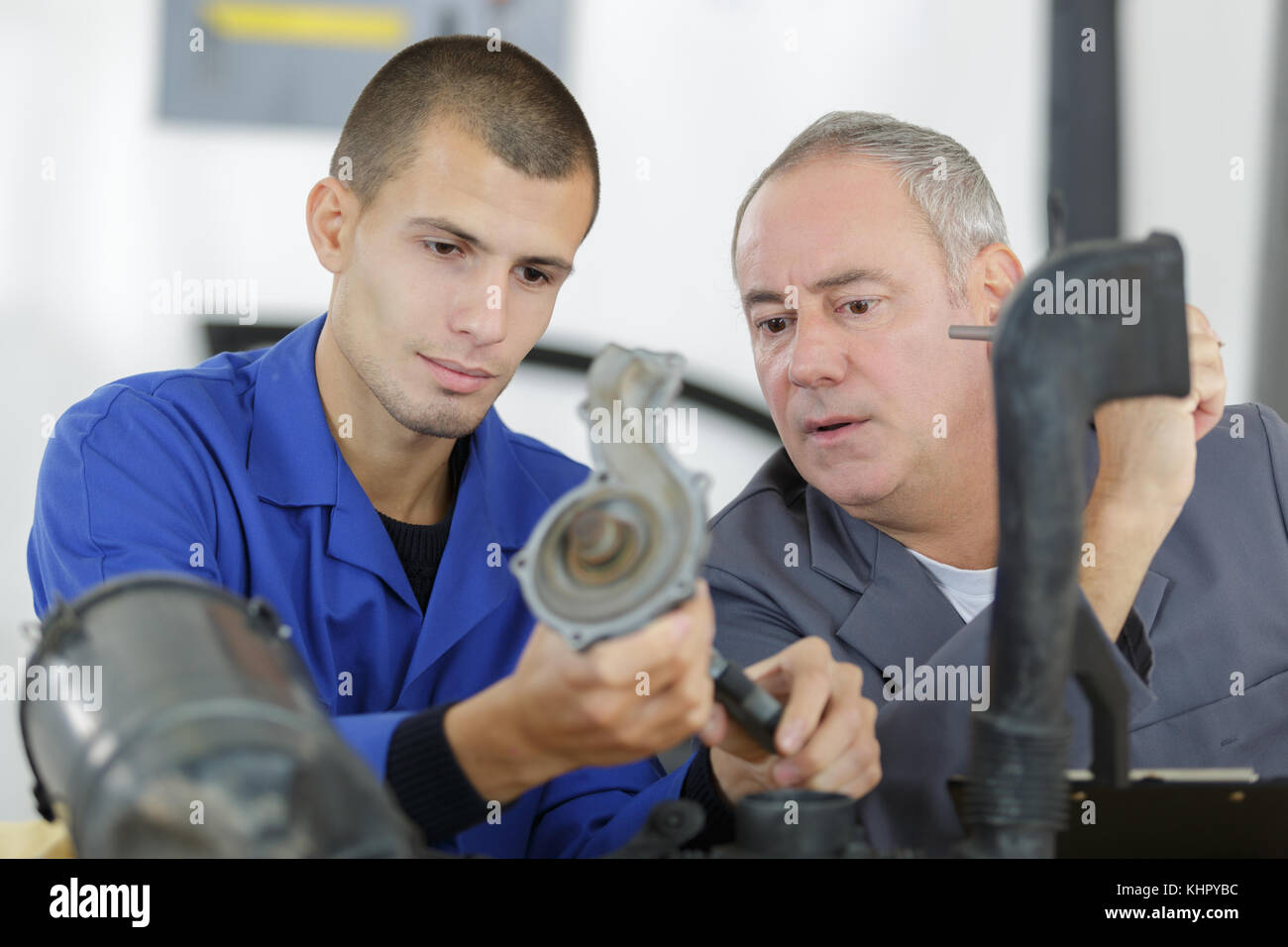 vehicle parts assembler apprentice Stock Photo - Alamy