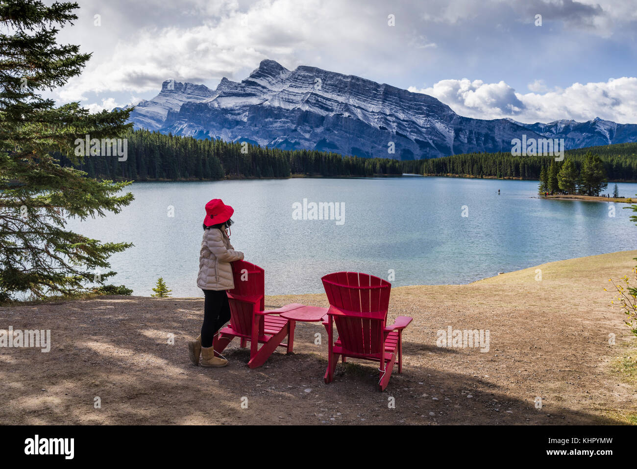 Tourist, red chairs, Banff National Park Stock Photo