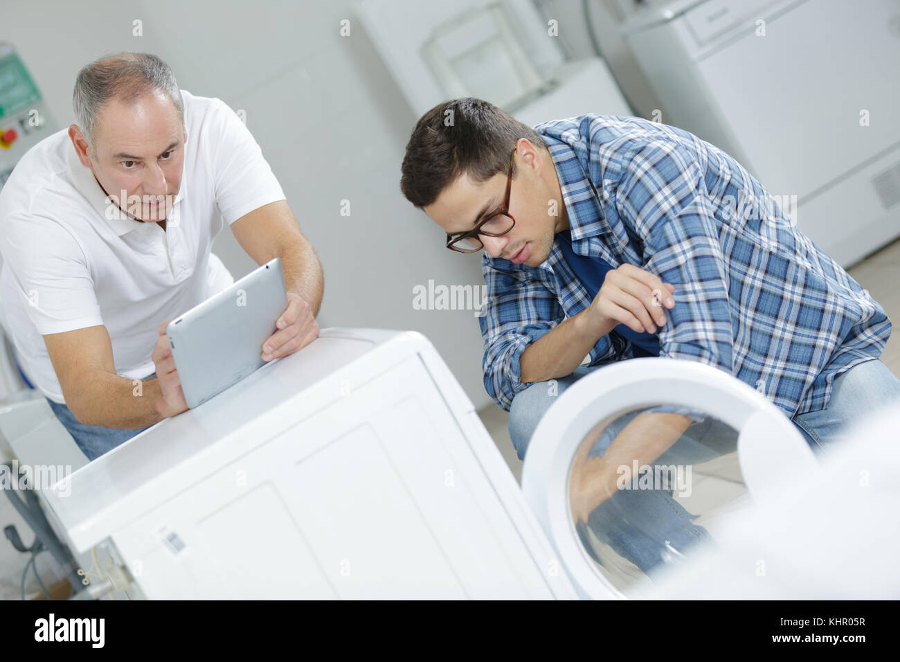 washing machine warranty technicians Stock Photo Alamy