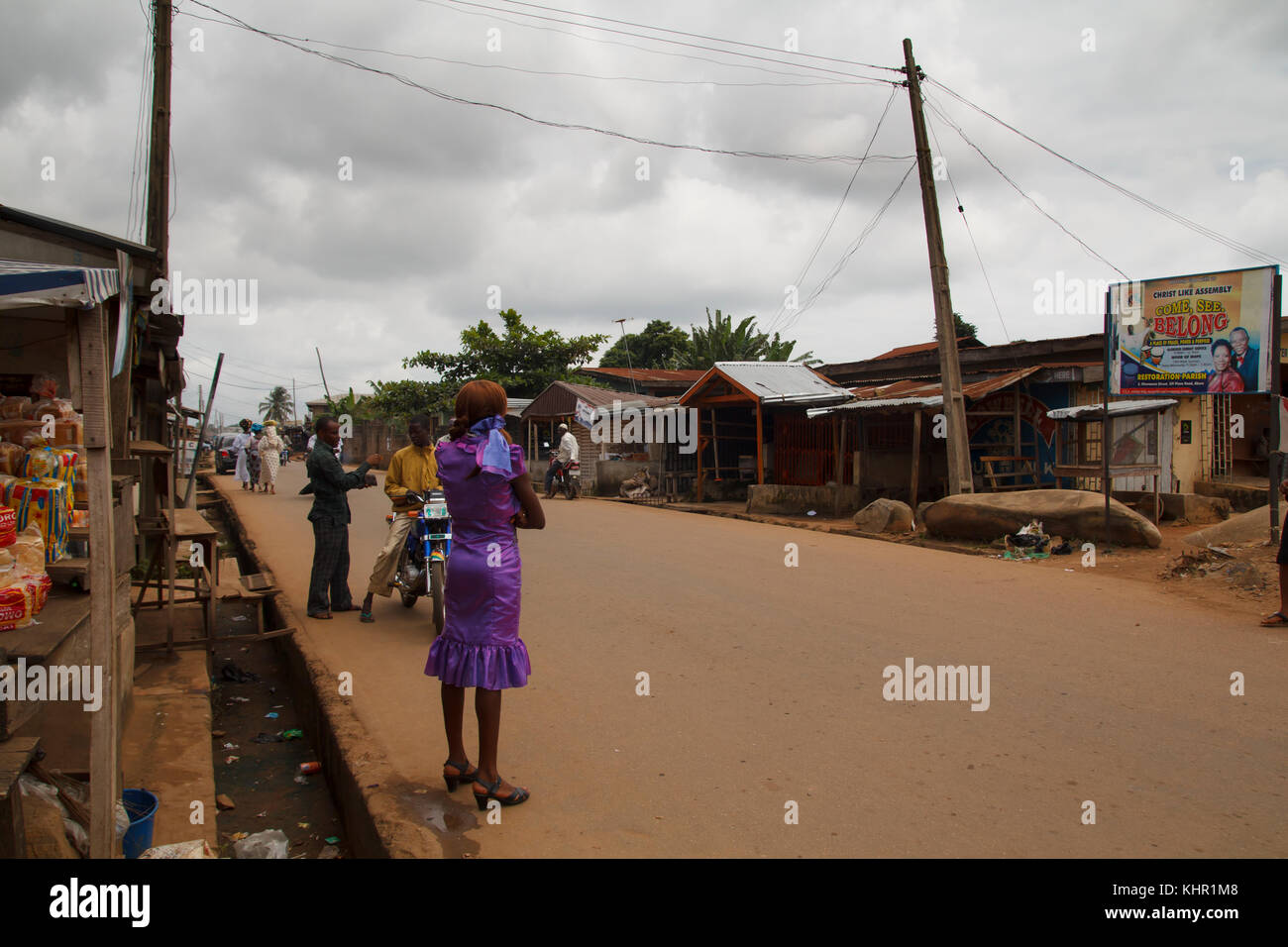 Nigerian men and woman in the street in the city of Akure in Ondo state, Nigeria Stock Photo