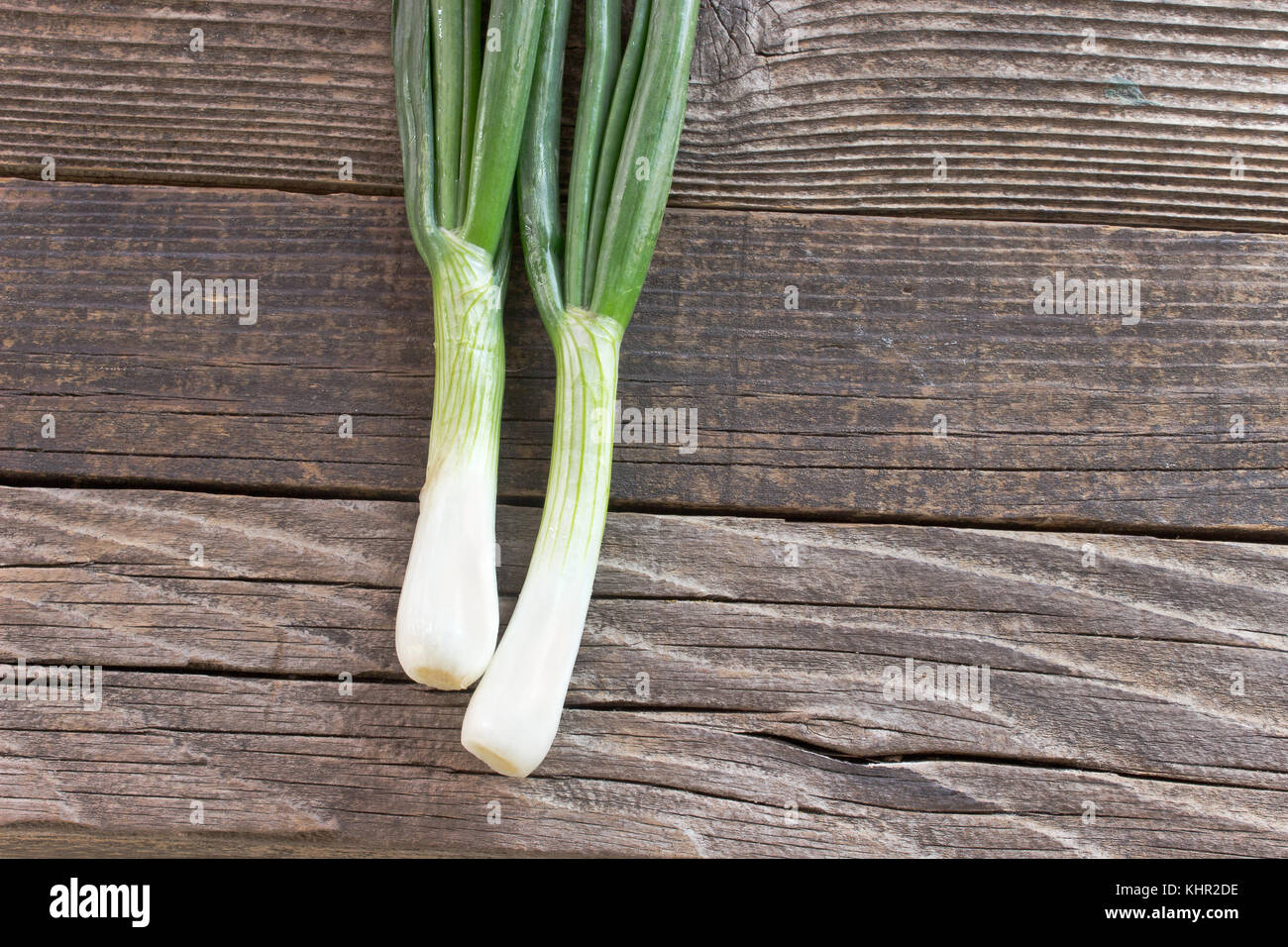 Young onion on wooden background Stock Photo - Alamy