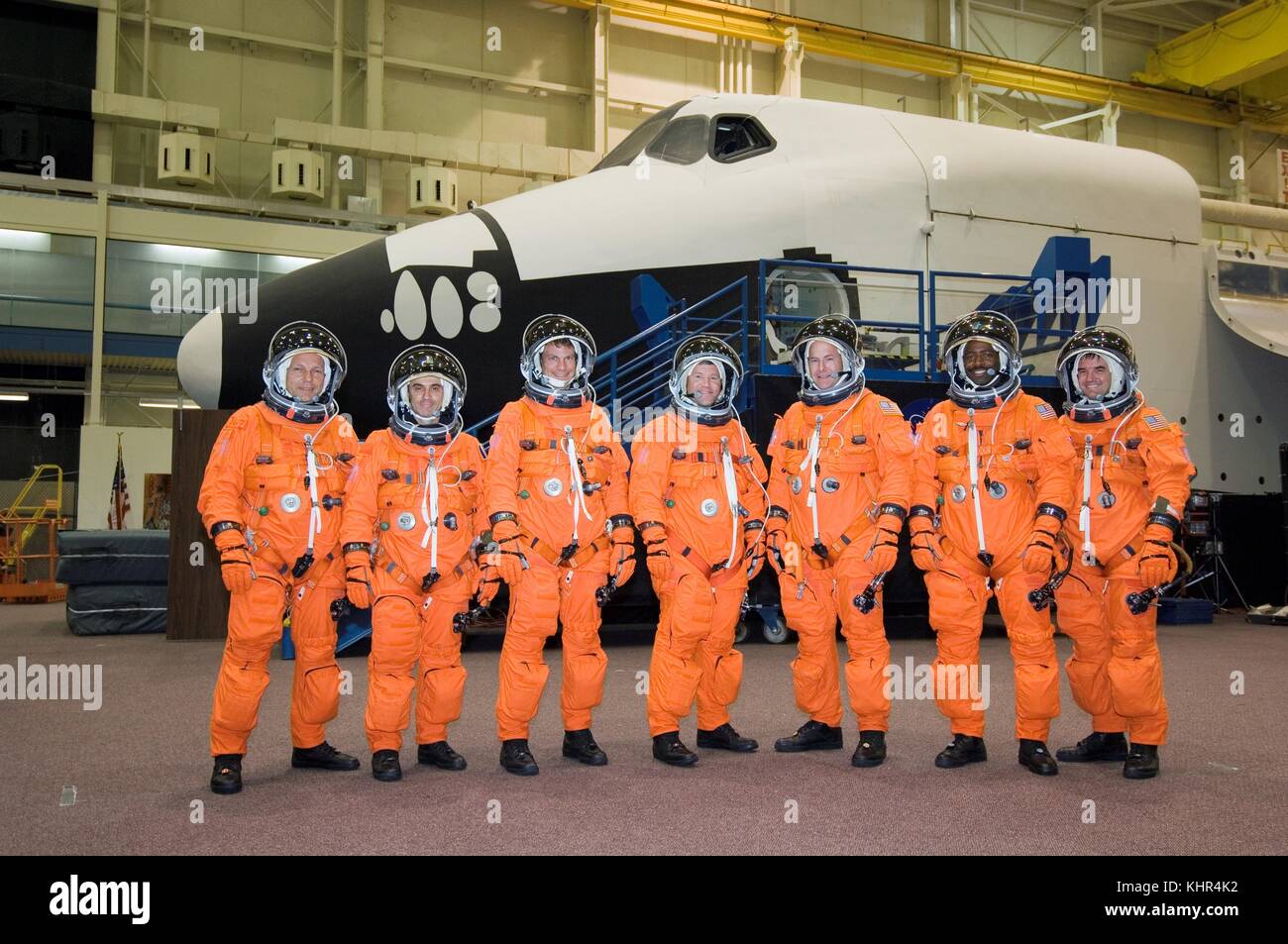 NASA International Space Station Space Shuttle Atlantis STS-122 mission prime crew members (L-R) German astronaut Hans Schlegel and French astronaut Leopold Eyharts from the European Space Agency, and American astronauts Stanley Love, Stephen Frick, Alan Poindexter, Leland Melvin and Rex Walhein wear orange launch and entry spacesuits during a pre-launch training session at the Johnson Space Center Space Vehicle Mockup Facility May 1, 2007 in Houston, Texas.  (photo by NASA Photo via Planetpix) Stock Photo