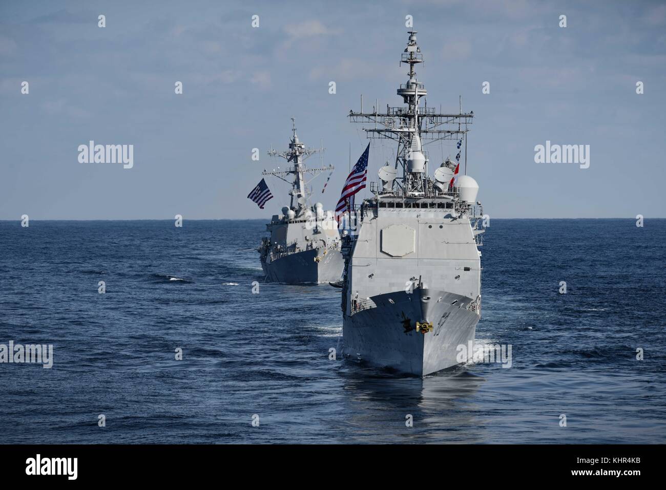 The U.S. Navy Ticonderoga-class guided-missile cruiser USS Bunker Hill (front) and the U.S. Navy Arleigh Burke-class guided-missile destroyer USS Preble steam in formation November 12, 2017 in the Pacific Ocean.  (photo by Alex Perlman via Planetpix) Stock Photo