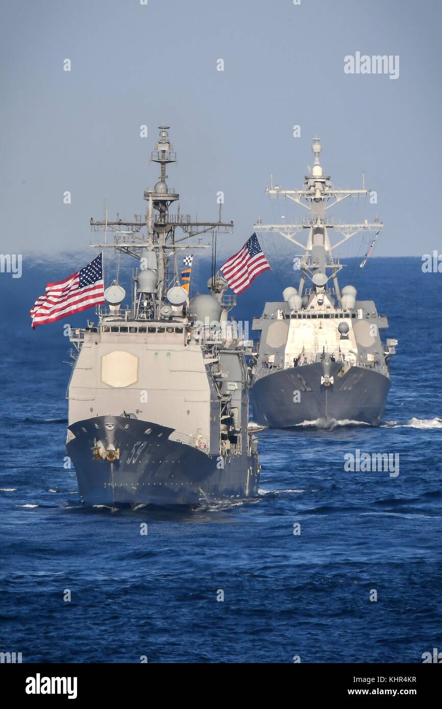 The U.S. Navy Ticonderoga-class guided-missile cruiser USS Princeton (front) and the U.S. Navy Arleigh Burke-class guided-missile destroyer USS Sampson steam in formation November 12, 2017 in the Pacific Ocean.   (photo by Spencer Roberts via Planetpix) Stock Photo