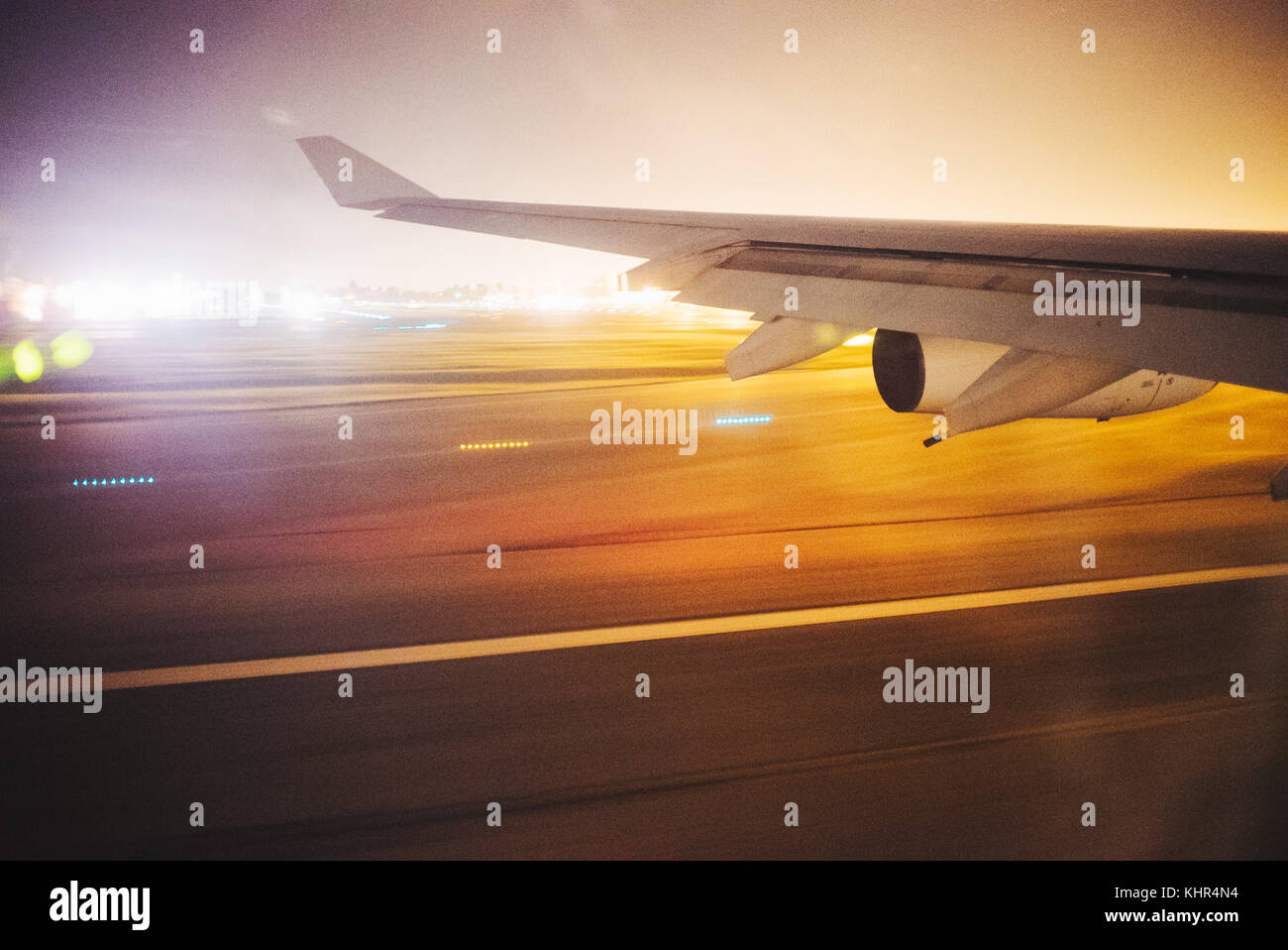 The window view from an Airbus A340-300 of Air France, departing Bogota El Dorado international airport at night Stock Photo
