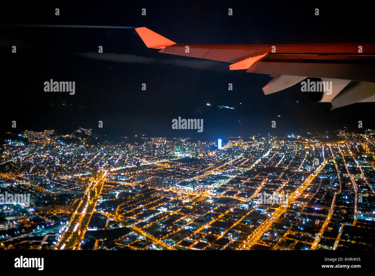 The window view from an Airbus A340-300 of Air France, departing Bogota El Dorado international airport at night Stock Photo